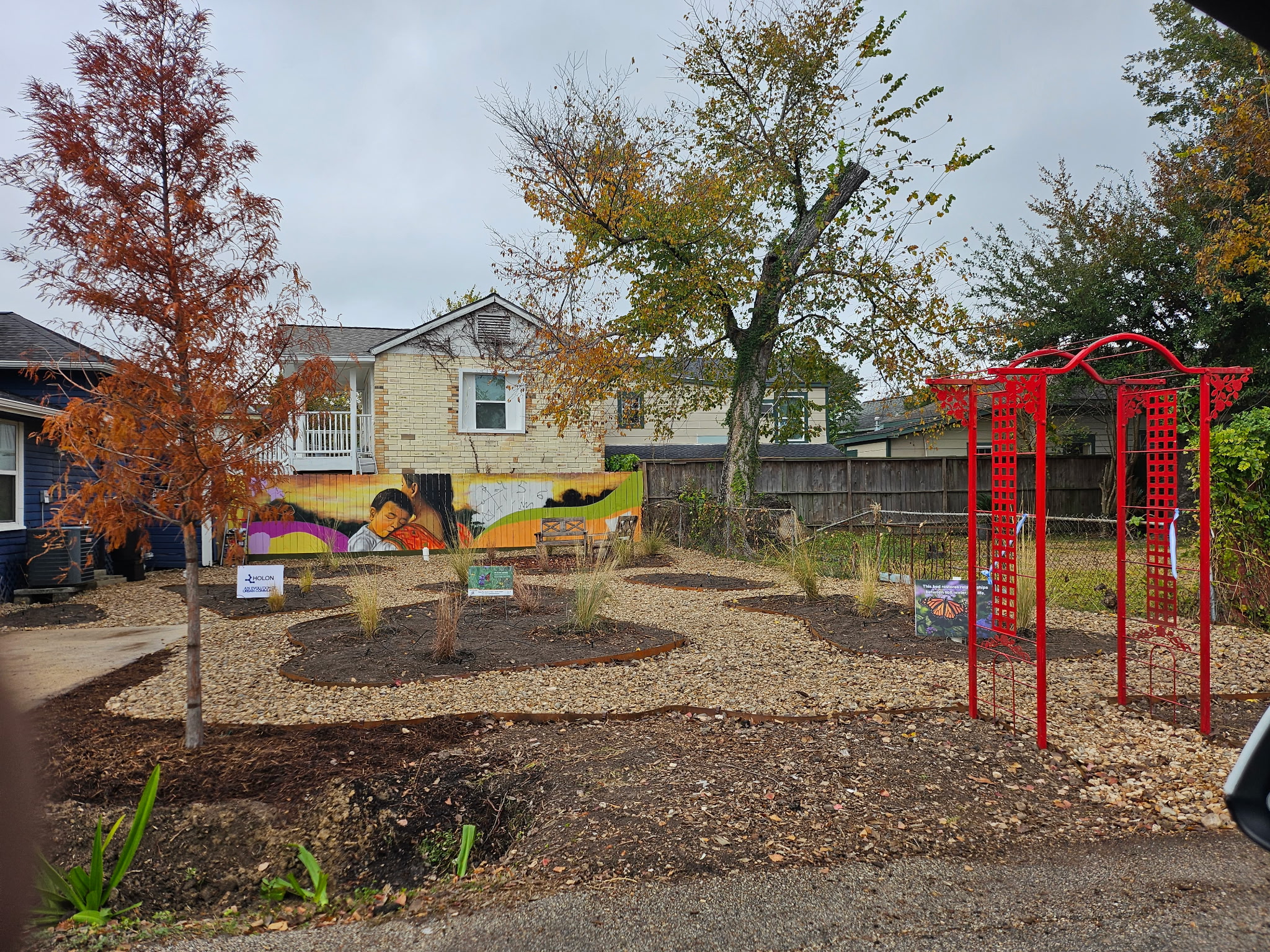 Community garden with mural and native plantings